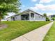View of the home exterior showcasing a covered porch and well-maintained lawn at 505 Belle Grove Dr, Lake Wylie, SC 29710
