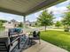 Relaxing covered front porch provides a comfortable outdoor space with seating and scenic neighborhood views at 505 Belle Grove Dr, Lake Wylie, SC 29710