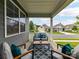 Inviting covered front porch featuring comfortable seating and neighborhood views at 505 Belle Grove Dr, Lake Wylie, SC 29710