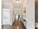 Elegant hallway featuring hardwood floors, crown molding and a view to living spaces at 505 Belle Grove Dr, Lake Wylie, SC 29710
