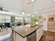 Open concept living area featuring an island with barstool seating and stainless steel appliances at 505 Belle Grove Dr, Lake Wylie, SC 29710