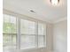 Window with white blinds in a room with white trim and beige walls at 505 Belle Grove Dr, Lake Wylie, SC 29710