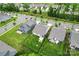 Aerial view showcasing a home's well-maintained lawn, fenced backyard, and proximity to neighborhood streets at 5079 Skyfest Dr, Charlotte, NC 28215