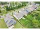 Aerial view of a home with fenced backyard, lush green lawn, and mature trees in a well-kept neighborhood at 5079 Skyfest Dr, Charlotte, NC 28215