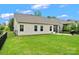 Well-manicured backyard offering ample space for outdoor activities, featuring a fence and screened porch at 5079 Skyfest Dr, Charlotte, NC 28215