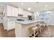 Stylish kitchen with white cabinets, granite countertops, stainless steel appliances, and pendant lighting at 5079 Skyfest Dr, Charlotte, NC 28215