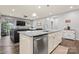 Open concept kitchen with granite island, stainless steel appliances, and view to living room at 5079 Skyfest Dr, Charlotte, NC 28215