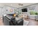 Spacious living room with modern decor, a large sectional sofa, and a ceiling fan at 5079 Skyfest Dr, Charlotte, NC 28215