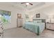 Bright bedroom featuring tray ceiling, neutral paint, carpet flooring, and plenty of natural light at 5079 Skyfest Dr, Charlotte, NC 28215