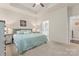 Spacious main bedroom with neutral paint, carpet flooring, and ensuite bathroom at 5079 Skyfest Dr, Charlotte, NC 28215