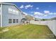 Spacious backyard featuring a gazebo, patio, grill, manicured lawn, and privacy fence at 5125 Thomasville Dr, Belmont, NC 28012