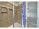 Modern bathroom featuring a glass-enclosed shower with niche and ceramic tile at 5125 Thomasville Dr, Belmont, NC 28012