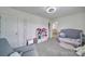 bedroom with neutral decor, a crib, and a view into the hallway at 5125 Thomasville Dr, Belmont, NC 28012