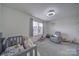 Charming bedroom featuring a teddy bear, comfortable chair, and a small window at 5125 Thomasville Dr, Belmont, NC 28012