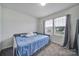 Neutral bedroom featuring a daybed, carpeting, and a window with natural light at 5125 Thomasville Dr, Belmont, NC 28012