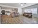 Bright living room open to the kitchen with modern flooring, comfortable seating, and plenty of natural light at 5125 Thomasville Dr, Belmont, NC 28012