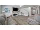 Spacious living room with stone fireplace, tv, modern flooring, and ample seating arrangement at 5125 Thomasville Dr, Belmont, NC 28012