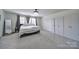 Bright main bedroom featuring carpeted floors, a decorative ceiling fan and a large wardrobe at 5125 Thomasville Dr, Belmont, NC 28012