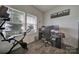 Bright office space with a large window, wood-look floors, and ample room for a home office setup at 5125 Thomasville Dr, Belmont, NC 28012