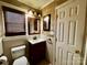 Bathroom with tiled floors, a modern vanity, and a framed mirror above the sink at 522 W Congress St, Lincolnton, NC 28092