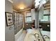 Bathroom featuring a combination tub and shower and gray walls at 522 W Congress St, Lincolnton, NC 28092