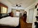 Cozy bedroom featuring a ceiling fan, hardwood floors, and warm, inviting decor at 522 W Congress St, Lincolnton, NC 28092