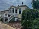 Charming home featuring neutral siding, white trim, covered front porch, and established landscaping at 522 W Congress St, Lincolnton, NC 28092