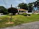 Charming home with inviting front porch and well-manicured lawn and landscaping at 522 W Congress St, Lincolnton, NC 28092