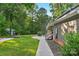 The backyard features a shed, mature trees, landscaping, and a sidewalk to the house at 5317 Black Oak Ln # 11, Waxhaw, NC 28173