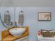 Bathroom featuring an elegant wood countertop, round mirror and wooden decor at 5317 Black Oak Ln # 11, Waxhaw, NC 28173