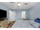 Comfortable bedroom with light blue walls, wood floors, and neutral-toned furnishings at 5317 Black Oak Ln # 11, Waxhaw, NC 28173