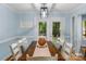 Elegant dining room with a wooden table, seating for eight, and a view of the outdoor scenery at 5317 Black Oak Ln # 11, Waxhaw, NC 28173