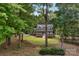 Secluded home surrounded by mature trees, featuring a well-manicured lawn and inviting front porch at 5317 Black Oak Ln # 11, Waxhaw, NC 28173