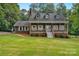 Traditional two-story home with a cozy front porch, set on a lush green lawn under a clear sky at 5317 Black Oak Ln # 11, Waxhaw, NC 28173