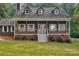 Charming home featuring a welcoming front porch, white-framed windows, and a well-maintained lawn at 5317 Black Oak Ln # 11, Waxhaw, NC 28173