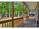View of long, covered front porch showcasing wood columns and railings, perfect for relaxing outdoors at 5317 Black Oak Ln # 11, Waxhaw, NC 28173
