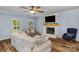 Living room featuring a stone fireplace with a mantle and bright windows at 5317 Black Oak Ln # 11, Waxhaw, NC 28173