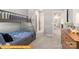 A bedroom featuring a gray bunk bed and a hall with multiple rooms at 5655 Arnold Way, Mount Pleasant, NC 28025