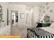 This bedroom features patterned walls with a desk and a large window at 5655 Arnold Way, Mount Pleasant, NC 28025