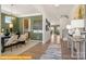 Inviting dining room featuring stylish chandelier, wood floors and abundant natural light at 5655 Arnold Way, Mount Pleasant, NC 28025