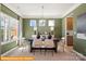 Inviting dining room featuring stylish chandelier and plentiful sunshine at 5655 Arnold Way, Mount Pleasant, NC 28025