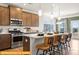 Spacious kitchen with island seating, stainless appliances, and stylish pendant lighting at 5655 Arnold Way, Mount Pleasant, NC 28025
