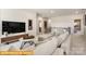 Upstairs living room with plush sofa, modern decor, and plenty of natural light at 5655 Arnold Way, Mount Pleasant, NC 28025