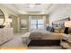 Tranquil main bedroom features a tray ceiling and decorative wall at 5655 Arnold Way, Mount Pleasant, NC 28025