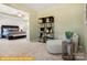 Sitting room with view into Primary bedroom, chaise lounge, and modern décor at 5655 Arnold Way, Mount Pleasant, NC 28025