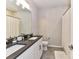 Bathroom featuring dual sinks, white cabinets, and shower curtain offering a clean functional space at 5811 Mantle Way, Kannapolis, NC 28081