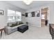 Cozy bonus room with a comfortable sofa and movie posters, perfect for relaxation at 5811 Mantle Way, Kannapolis, NC 28081