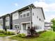 Attractive two-story gray townhome with well-manicured lawn and white picket fence at 5811 Mantle Way, Kannapolis, NC 28081