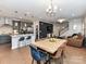 Open-concept living space featuring a dining area, modern kitchen, and cozy seating at 5811 Mantle Way, Kannapolis, NC 28081