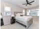 Bright bedroom featuring a rustic bed frame, carpet, and abundant natural light from large windows at 5811 Mantle Way, Kannapolis, NC 28081